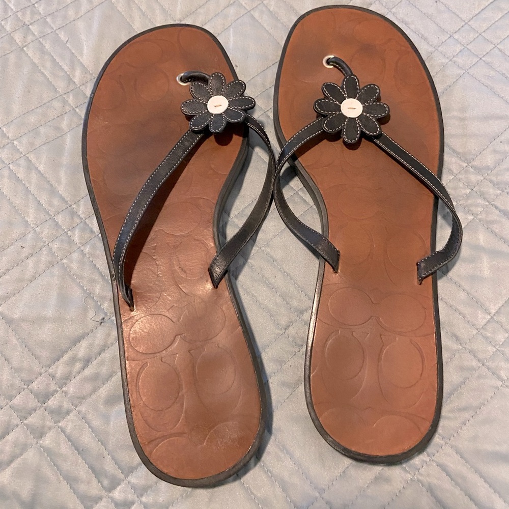 Coach leather black and white daisy flip flop sandals